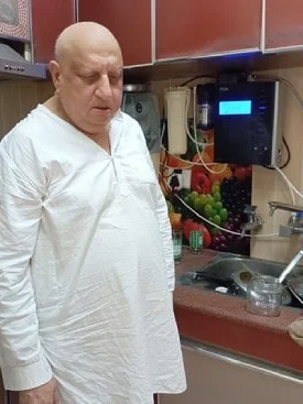 Satisfied male customer with his Chanson Quality Water Purifier